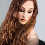 Woman with Curly Colored Hair — Beauty Treatments in Mareeba, QLD